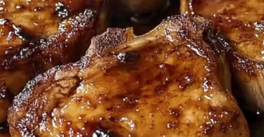 Delicious brown sugar chops served with a side of vegetables