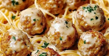 Delicious garlic butter chicken balls served with creamy parmesan pasta.