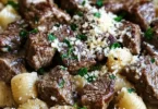 Delicious garlic butter steak bites served with creamy parmesan shells