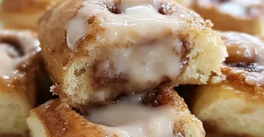 Freshly baked King's Hawaiian cinnamon rolls with icing on top.