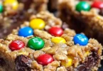 Delicious homemade Monster Cookie Bars with oats, chocolate chips, and M&Ms