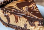 No-Bake Chocolate Peanut Butter Swirl Pie topped with chocolate and peanut butter