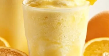 Refreshing Orange Julius smoothie topped with whipped cream.