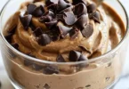 Delicious Peanut Butter Cup Protein Mousse topped with chocolate and peanuts
