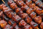 Delicious barbecue skewers grilled to perfection with colorful vegetables and meat.