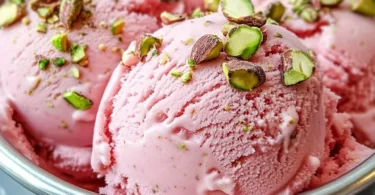 Delicious Watermelon Pistachio Ice Cream in a bowl, garnished with fresh pistachios.