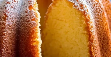 Slice of delicious 7 Up Pound Cake on a plate, showcasing its light texture and lemony flavor.