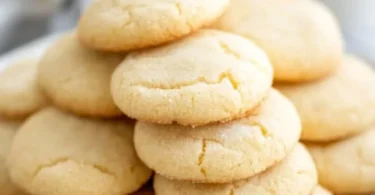 Freshly baked Amish Sugar Cookies stacked on a plate