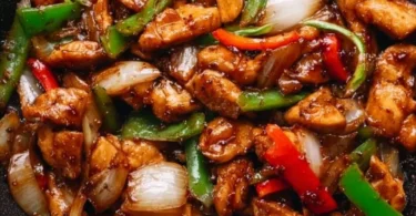Delicious black pepper chicken cooked with aromatic spices and served with vegetables.
