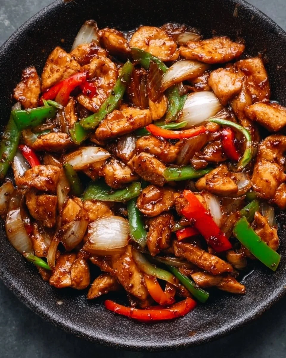 Delicious black pepper chicken cooked with aromatic spices and served with vegetables.