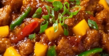 Chinese style mango chicken stir fry with colorful vegetables and tender chicken