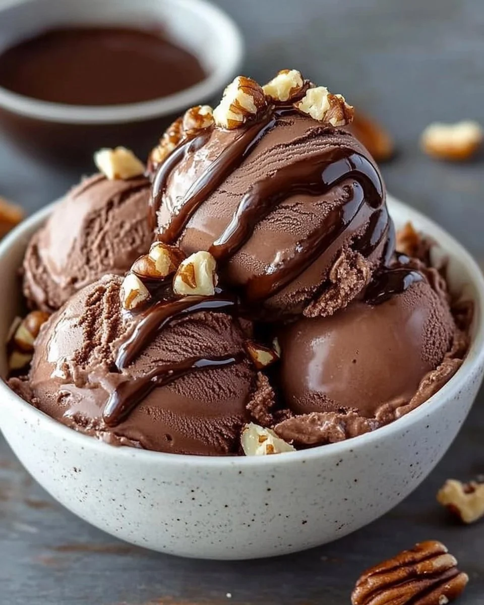 Delicious Choco-Nut Fudge Ice Cream topped with nuts and fudge sauce