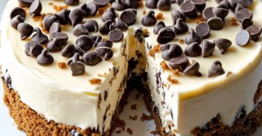 Delicious chocolate chip cookie dough cheesecake with creamy layers and cookie dough toppings.