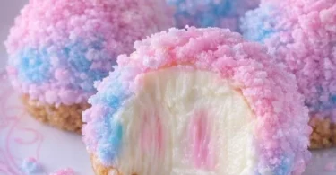 Crispy Cotton Candy Cheesecake Bombs served on a colorful dessert platter.