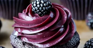 Delicious dark chocolate blackberry cupcakes with frosting