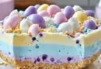 Colorful Easter Jell-O Pie with fruit toppings and a graham cracker crust