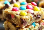 Delicious easy cake mix cookie bars with chocolate chips and sprinkles