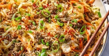 Healthy egg roll in a bowl with vegetables and savory sauce