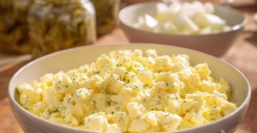 Delicious homemade egg salad served in a bowl with fresh herbs