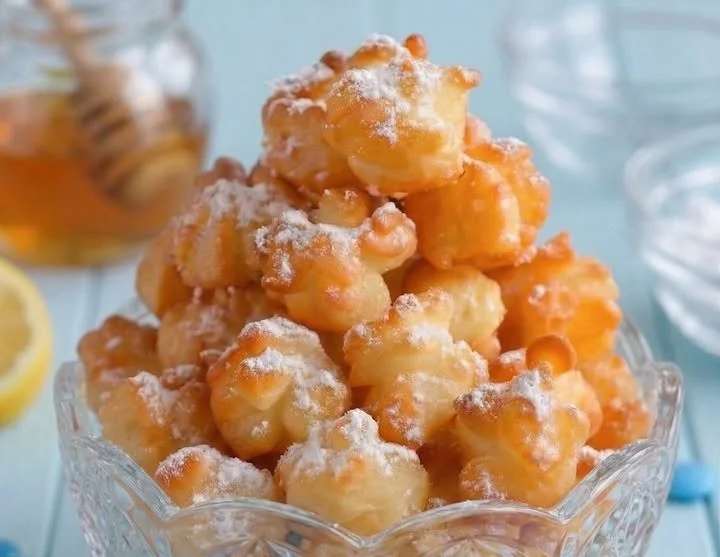 Delicious funnel cake bites served with powdered sugar