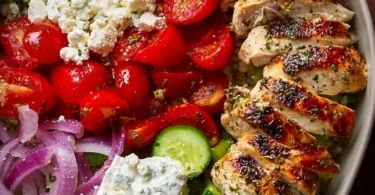 Delicious Greek Chicken Bowls with fresh vegetables and Mediterranean flavors.