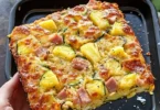 Hawaiian Pizza Zucchini Slice topped with pineapple and ham