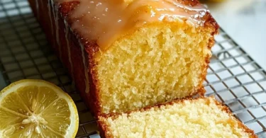 Healthy Greek Yogurt Lemon Loaf Cake topped with fresh lemons