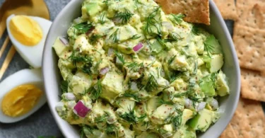 Herby Avocado Egg Salad with fresh herbs and eggs in a bowl