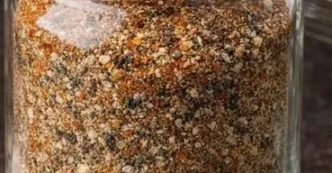 Bowl of homemade magic seasoning with various herbs and spices