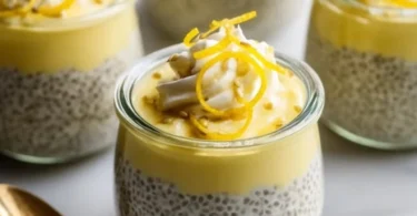 Creamy lemon chia pudding topped with fresh lemon zest and chia seeds