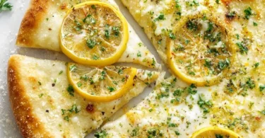 Lemon Pizza with lemon slices and fresh herbs