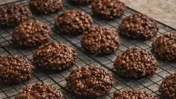 No-Bake Chocolate Caramel Crunch Cookies topped with crunchy bits and drizzled caramel
