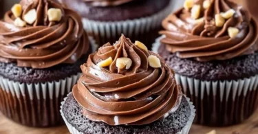 Delicious Nutella Cupcakes topped with chocolate frosting