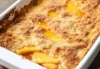 Easy Peach Dump Cake dessert with juicy peaches and golden cake topping