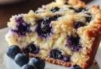 Sour cream blueberry coffee cake with fresh blueberries on top
