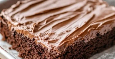 Delicious homemade Texas Sheet Cake topped with chocolate frosting
