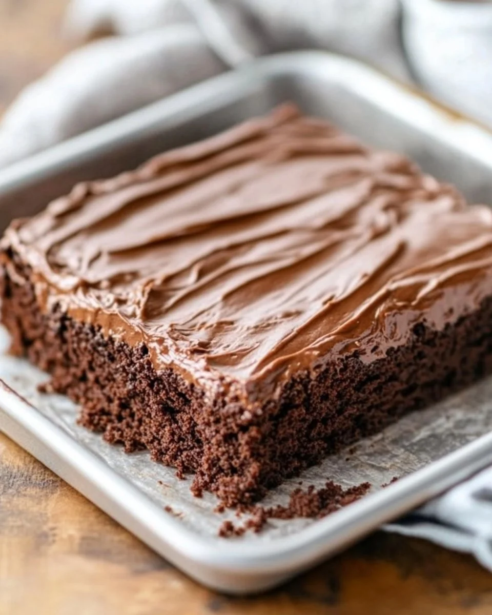 Delicious homemade Texas Sheet Cake topped with chocolate frosting