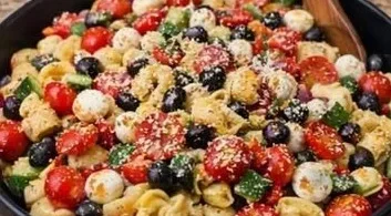 Colorful bowl of Tortellini Pasta Salad with fresh vegetables and dressing