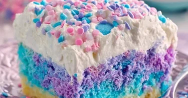 Colorful Unicorn Poke Cake with vibrant layers and frosting