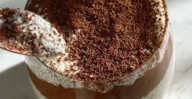 Viral tiramisu chia pudding with layers of coffee and cocoa flavors, served in a glass.