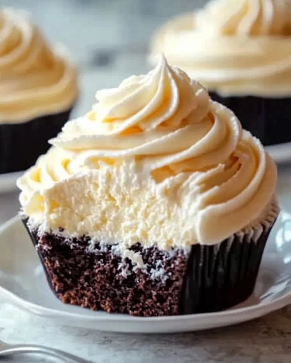 Whipped vanilla pudding frosting swirled on a luscious cake