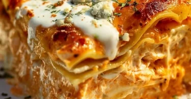 Cheesy Buffalo Ranch Chicken Lasagna with a spicy creamy topping