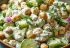Chickpea cucumber salad with creamy yogurt dressing in a bowl
