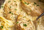 Delicious Crock Pot Angel Chicken served with rice and vegetables.