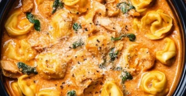 Delicious CrockPot Chicken Tortellini ready to serve in a bowl