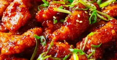 Dragon Chicken dish served with vibrant vegetables and spicy sauce