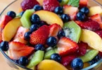 Colorful fruit salad with honey lime dressing