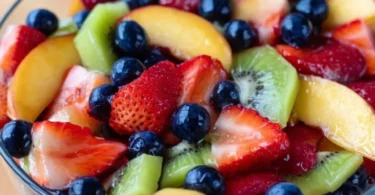 Colorful fruit salad with honey lime dressing