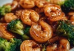 High-protein honey garlic shrimp served with vegetables on a plate