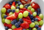 Honey Lime Fruit Salad with assorted fresh fruits and a tangy honey lime dressing